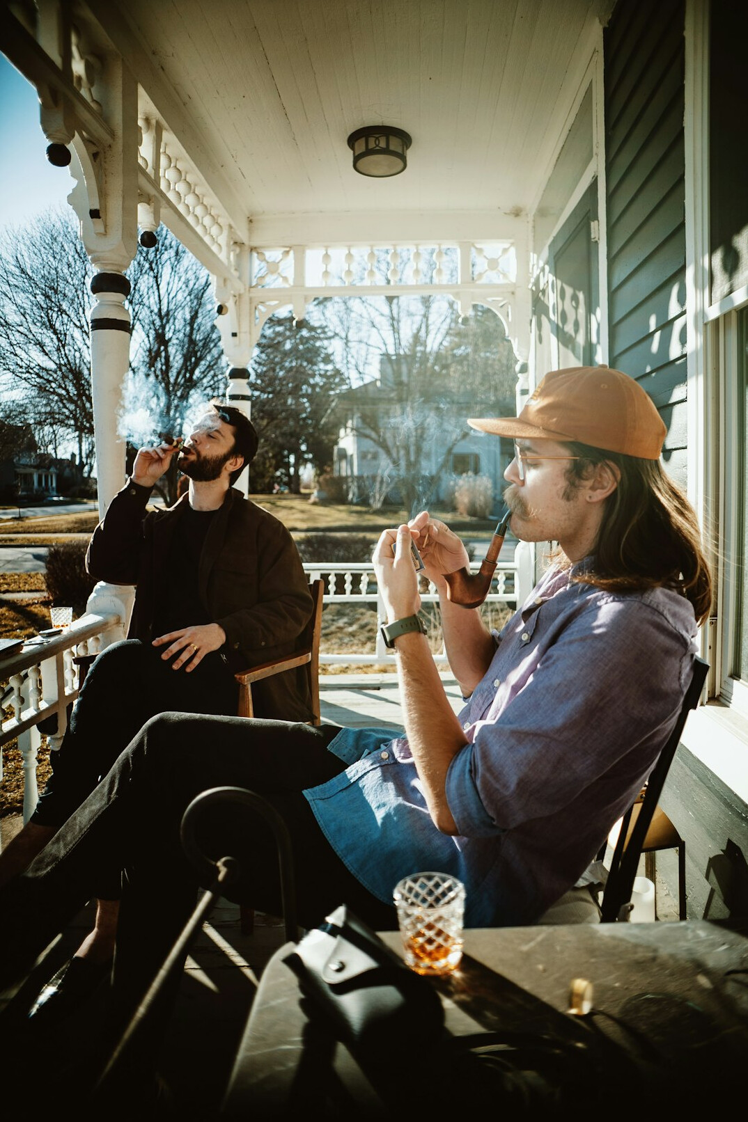 Two people having a warm conversation on a porch